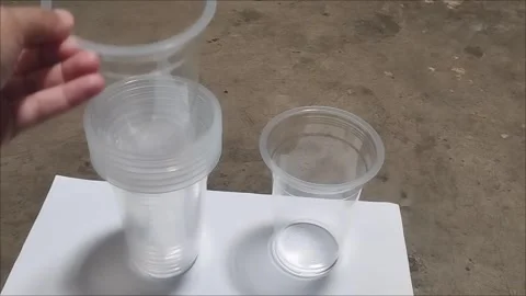 Plastic cups for grass jelly ice are stacked Stock Footage 294876930