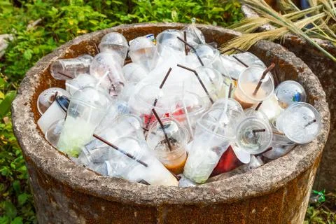 Plastic cups in trashcan. Stock Photos