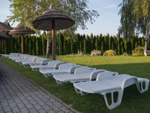 Plastic deck chair in the garden 写真素材