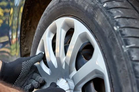 A plastic decorative plug is attached to the car disc. Auto accessories. Ca.. Stock Photos