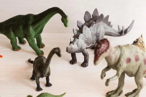 Plastic dinosaur figures of extinct ancient creatures and  favorite toys of k Stock Photos