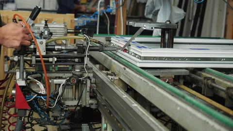 Plastic doors and windows manufacturing facility - operating machine close up Видео 201130101