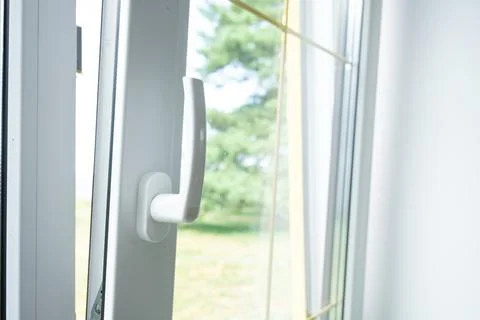 Plastic double-glazed window opened for ventilation, quality hardware, busi.. 库存照片