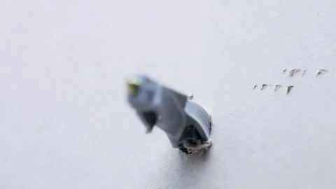 Plastic dowel mounted into the plasterboard for metal screw fixing Stock-Footage 303062830