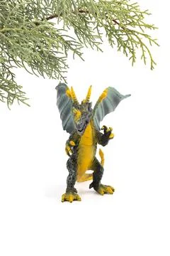 Plastic dragon toy on white background. The Simbol of new year 2024. Stock Photos