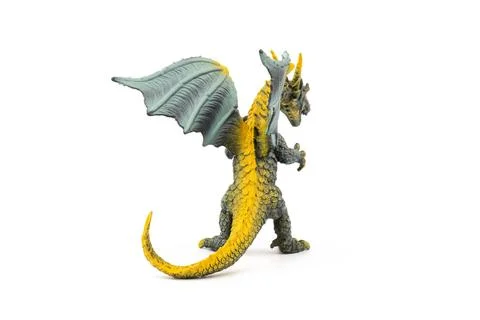 Plastic dragon toy on white background. The Simbol of new year 2024. Stock Photos