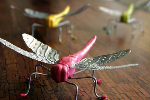 Plastic dragonfly on a table Stock Photos