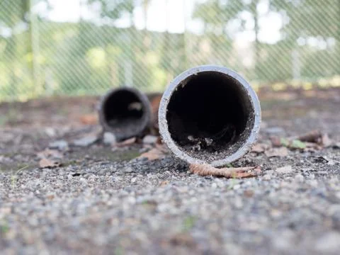 Plastic drain pipe filled with some mud Stock Photos