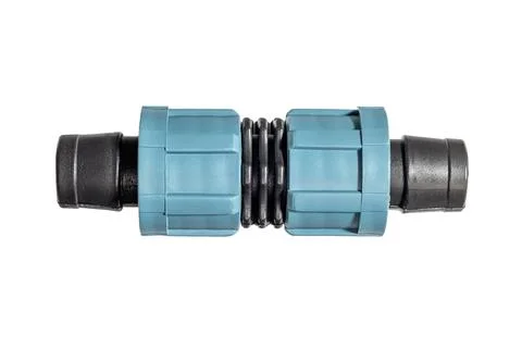 Plastic drip irrigation hose connector fitting with threaded coupling nuts Stock Photos