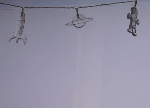 Plastic elements of the universe on an electric wire Stock Photos