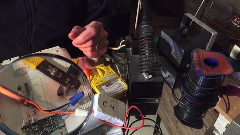 Plastic explosive loaded into laptop computer, slider view Stock-Footage 74274230