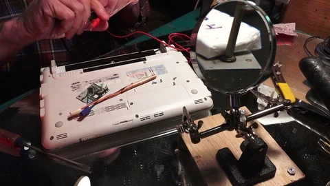 Plastic explosive loaded into laptop computer,checking circute Stock-Footage 74362603