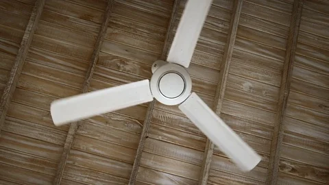 Plastic Fan Hangs from a Wooden Ceiling, Spinning Slowly. Stock Footage 73766853
