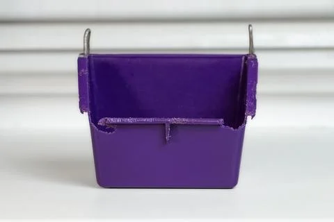 Plastic feeder for rodents.Worn and gnawed plastic feeder. Stock Photos