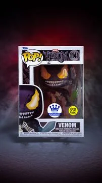 Plastic figurine of the comic book character Venom displayed in a Pop box Stock Photos
