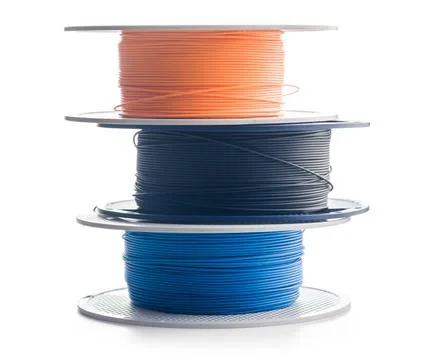 Plastic filament on a spool for 3D printer isolated on white background. Stock Photos