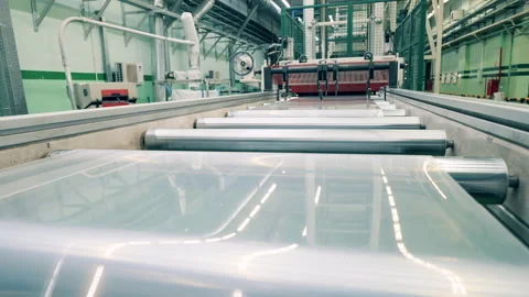 Plastic film unreeling for plastic ware manufacturing Stock Footage 145046198