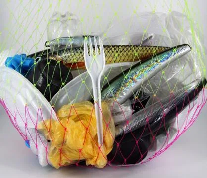 Plastic fish, plastic trash in the net Stock Photos