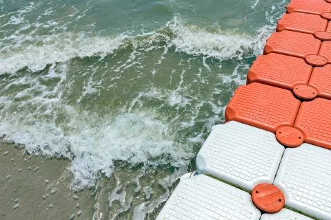 Plastic Floating Dock, Plastic Pontoon Cubes in the sea in sunny day Stock Photos