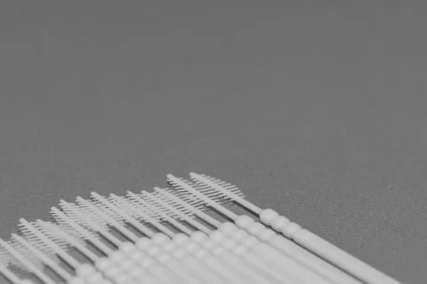 Plastic flossing picks on gray Stock Photos