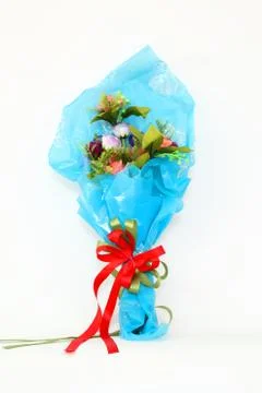 Plastic flowers on a white background. Stock Photos