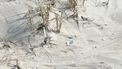 Plastic foil pollution in beach sand Stock-Footage 138377722