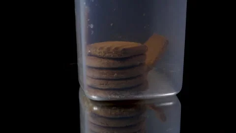 A plastic food container with biscuits in it for safe and air tight storage Stock Footage 263046842
