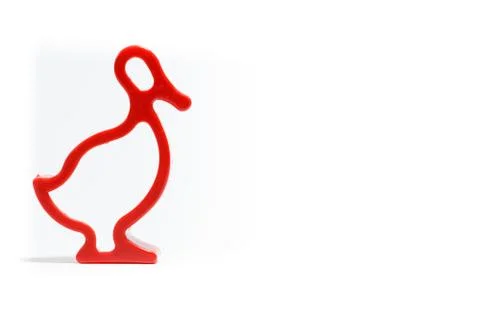 Plastic form for baking on white background. Isolated. Red Plastic duck form. Stock Photos