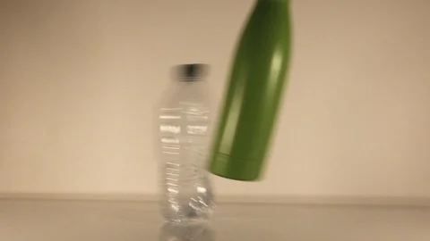 Plastic free Replacing Water Plastic Bottle with a reusable Bottle Slow Motion Stock Footage 123459151