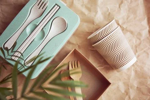 Plastic free, zero waste, disposable tableware and cardboard cups on crumpled Stock Photos
