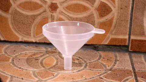 Plastic funnel isolated on ceramic Stock Photos