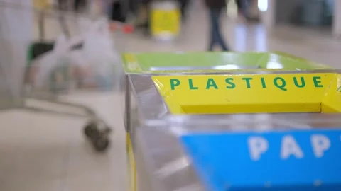 Plastic garbage bin trash container. Human waste recycling can. hand throwing in Stock Footage 234534251