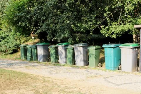 Plastic garbage bins in the forest area. trash cans for recycling Stock Photos