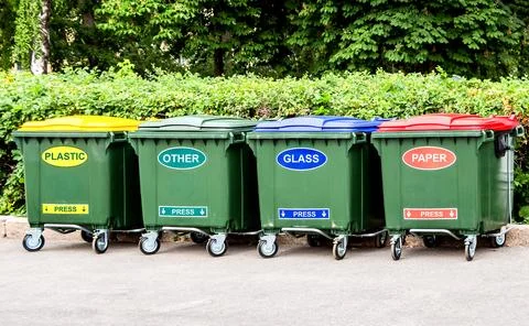 Plastic garbage containers for separate collection of waste Stock Photos