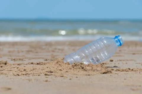 Plastic garbage dropped on the beach as poor environment and pollution problem. Stock Photos