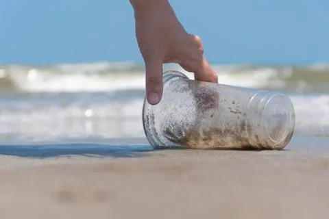 Plastic garbage dropped on the beach as poor environment and pollution problem. Stock Photos