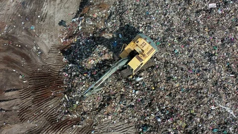 Plastic garbage dumped at landfill Stock Footage 128965737