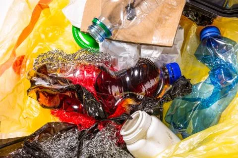 Plastic garbage with empty plastic bottles and other rubbish Stock Photos
