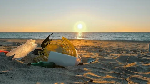 Plastic Garbage pile on beach sunset sea motion,polluted nature,people timelapse Stock Footage 126047703