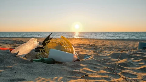 Plastic Garbage pile on sunset sea motion,polluted nature and people timelapse Stock Footage 122504557