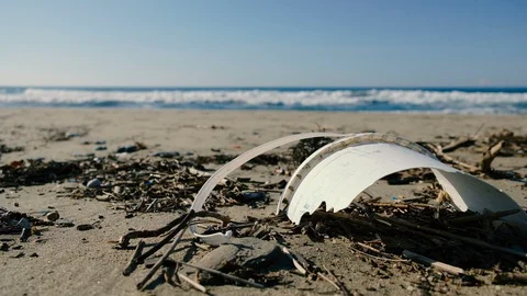 Plastic garbage on polluted beach over sea waves motion,dirty planet ecosystem Stock Footage 120424169