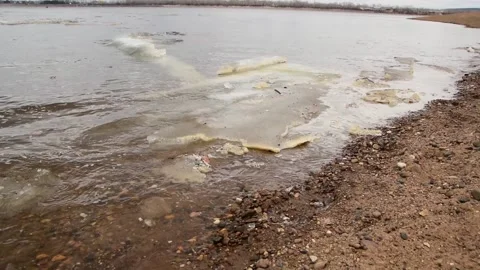 Plastic garbage pollution of the river bank. container,world environment day Stock Footage 237705010