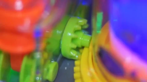 Plastic Gear Wheels Working Inside A Toy, Macro Stock Footage 310901046