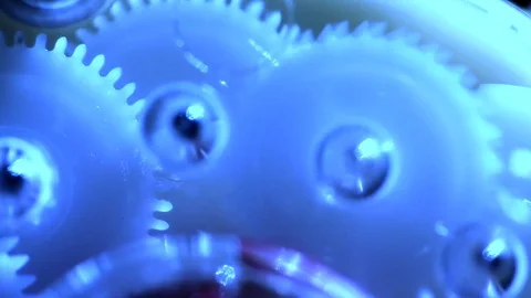Plastic gears are connected with each other, work in teams Stock Footage 81773954