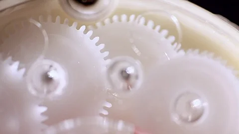 Plastic gears are connected with each other, work in teams Stock Footage 81773964