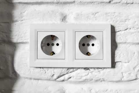 Plastic German double socket-outlets type F with grounding. Pair of empty Stock Photos