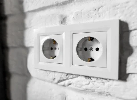 Plastic German double socket-outlets type F with grounding. Pair of empty Stock Photos