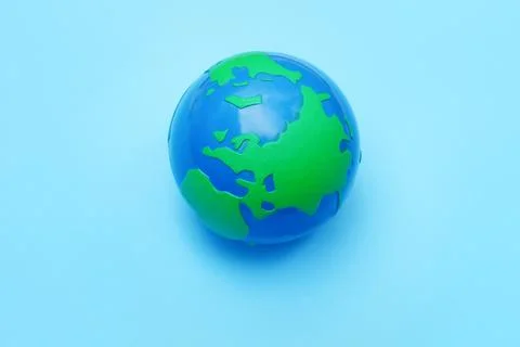 Plastic globe on blue background. The view from the top Stock-Fotos
