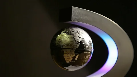 Plastic globe levitation rotate dark background nobody hd footage Stock Footage 104665898