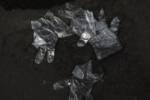 Plastic gloves on the ground Stock Photos